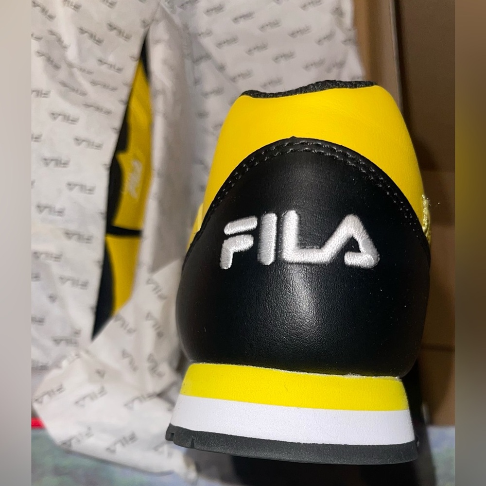 FILA athletic shoe 
Color: Lemon/Wht/Blk